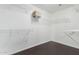 Spacious walk-in closet with wire shelving and hardwood floors, providing ample storage at 4626 N 111Th Ln, Phoenix, AZ 85037