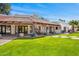 An expansive backyard features a covered patio and lush, green grass at 5838 E Berneil Ln, Paradise Valley, AZ 85253