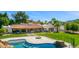 Expansive backyard with pool, fire pit, outdoor kitchen, and covered patio, perfect for entertaining at 5838 E Berneil Ln, Paradise Valley, AZ 85253