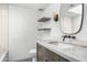 Well-lit bathroom features a marble vanity, geometric floor tiles, and floating shelves at 5838 E Berneil Ln, Paradise Valley, AZ 85253