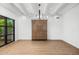 Bright bedroom with modern decor, hardwood floors, and a large window with an inviting ambiance at 5838 E Berneil Ln, Paradise Valley, AZ 85253