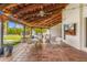 Inviting covered patio with tile flooring, comfortable seating, and overhead lighting at 5838 E Berneil Ln, Paradise Valley, AZ 85253