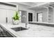 Spacious kitchen island offers marble counters, stainless sink, and leafy decor at 5838 E Berneil Ln, Paradise Valley, AZ 85253