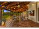 Charming covered patio featuring tile flooring and cozy seating at 5838 E Berneil Ln, Paradise Valley, AZ 85253