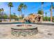 Gorgeous pool area features a grotto with a slide and a cozy fire pit at 5838 E Berneil Ln, Paradise Valley, AZ 85253