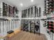 Spacious wine cellar features racks of various sizes and temperature control to store many bottles at 5838 E Berneil Ln, Paradise Valley, AZ 85253