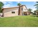 Expansive green backyard features a covered patio and a private pool, perfect for outdoor living at 5839 W Ironwood Dr, Glendale, AZ 85302