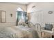 Comfortable bedroom featuring a decorative metal bed frame, and cozy chairs at 5839 W Ironwood Dr, Glendale, AZ 85302