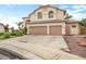 Charming two-story home with a two-car garage, desert landscaping, and mature trees at 5839 W Ironwood Dr, Glendale, AZ 85302