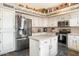 Bright kitchen featuring white cabinets, stainless steel appliances, and a center island at 5839 W Ironwood Dr, Glendale, AZ 85302