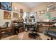 Functional office space with a built-in desk, storage, and wallpaper at 5839 W Ironwood Dr, Glendale, AZ 85302