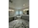 Luxurious bathroom with marble flooring, a freestanding tub, dual vanities, and glass block windows at 6337 W Deer Valley Rd, Glendale, AZ 85308
