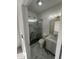 Stylish bathroom features marble floors, modern vanity, and glass-enclosed shower at 6337 W Deer Valley Rd, Glendale, AZ 85308