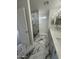 Modern bathroom with marble-look tile, a glass-enclosed shower, and dual sink vanity at 6337 W Deer Valley Rd, Glendale, AZ 85308