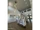 Stunning foyer with a curving staircase, wood floors, and modern chandelier creating a grand entrance at 6337 W Deer Valley Rd, Glendale, AZ 85308