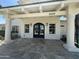 Charming front entrance with an ornate metal gate, stone flooring, and a covered portico at 6337 W Deer Valley Rd, Glendale, AZ 85308