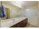 Bright bathroom featuring a double sink vanity and a walk-in shower at 67 N Montoro Ln, Casa Grande, AZ 85194