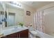 Bright bathroom features a large mirror, updated vanity, and shower-tub combination at 67 N Montoro Ln, Casa Grande, AZ 85194