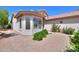 Charming home exterior with bay window and well-maintained landscaping at 67 N Montoro Ln, Casa Grande, AZ 85194