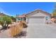 Charming single-story home with a two-car garage and desert landscaping at 67 N Montoro Ln, Casa Grande, AZ 85194