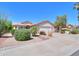 Single-story home featuring a two-car garage and desert landscaping at 67 N Montoro Ln, Casa Grande, AZ 85194