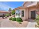 A cozy front entrance with a brick walkway and a bay window at 67 N Montoro Ln, Casa Grande, AZ 85194