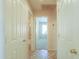 Hallway with a view of bedrooms and a bathroom, offering a glimpse of the home's layout at 67 N Montoro Ln, Casa Grande, AZ 85194