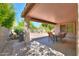 Inviting covered patio with outdoor dining set, perfect for entertaining at 67 N Montoro Ln, Casa Grande, AZ 85194