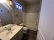 Well-maintained bathroom with a bathtub and shower combo, single sink vanity, and updated fixtures at 720 W Lydia Ln, Phoenix, AZ 85041