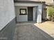 Exterior shows neutral colored walls, tiled driveway and covered entryway at 720 W Lydia Ln, Phoenix, AZ 85041