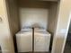 Convenient laundry room includes a washer and dryer set, situated in a closet with easy access at 720 W Lydia Ln, Phoenix, AZ 85041