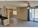 Open-concept living room with tile flooring, stainless steel appliances and access to the outdoor patio at 720 W Lydia Ln, Phoenix, AZ 85041
