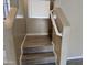 Tiled stairs leading to the next level are paired with a white handrail at 720 W Lydia Ln, Phoenix, AZ 85041