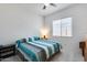 Cozy bedroom with a comfortable bed, soft lighting, and a large window for natural light at 7694 W Desert Spoon Dr, Peoria, AZ 85383