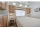 Cozy bedroom with a comfortable bed, soft lighting, and ample storage cabinets at 7750 E Broadway Rd # 535, Mesa, AZ 85208