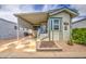 Charming manufactured home featuring stylish siding, a covered parking area and welcoming front entry at 7750 E Broadway Rd # 535, Mesa, AZ 85208