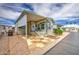 Charming single-Gathering home featuring an appealing exterior with manicured yard, driveway, and covered entrance at 7750 E Broadway Rd # 535, Mesa, AZ 85208