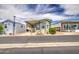 Charming single Gathering home with a covered porch and well maintained landscaping at 7750 E Broadway Rd # 535, Mesa, AZ 85208