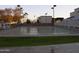 A recreation outdoor game court has lights and benches on each side for resting players at 7750 E Broadway Rd # 535, Mesa, AZ 85208
