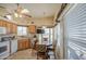 Charming kitchen with wooden cabinets, and a skylight that offers natural illumination at 7750 E Broadway Rd # 535, Mesa, AZ 85208