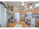 Charming kitchen with wooden cabinets and furniture, offering natural illumination at 7750 E Broadway Rd # 535, Mesa, AZ 85208