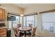 Charming breakfast nook with wooden cabinets and furniture, and large windows that offer natural illumination at 7750 E Broadway Rd # 535, Mesa, AZ 85208