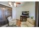 Inviting living room with light colored recliners and mounted television at 7750 E Broadway Rd # 535, Mesa, AZ 85208