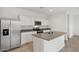 Bright kitchen features stainless steel appliances, granite countertops, and a center island at 8440 W Clemente Way, Florence, AZ 85132