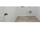 A practical laundry room with tile flooring and essential connections at 8440 W Clemente Way, Florence, AZ 85132