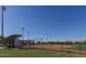 Baseball field featuring green grass and spectator seating at 8484 W Clemente Way, Florence, AZ 85132