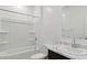 Bright bathroom with a shower-tub combo and marble countertop vanity at 8484 W Clemente Way, Florence, AZ 85132