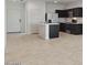 Open kitchen with a center island and stainless appliances adjacent to a separate dining area at 8484 W Clemente Way, Florence, AZ 85132