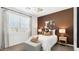 Bright bedroom featuring patterned curtains, accent wall and soft natural light at 8519 W Clemente Way, Florence, AZ 85132