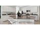 Modern kitchen featuring granite countertops, stainless steel appliances, and a center island at 8519 W Clemente Way, Florence, AZ 85132